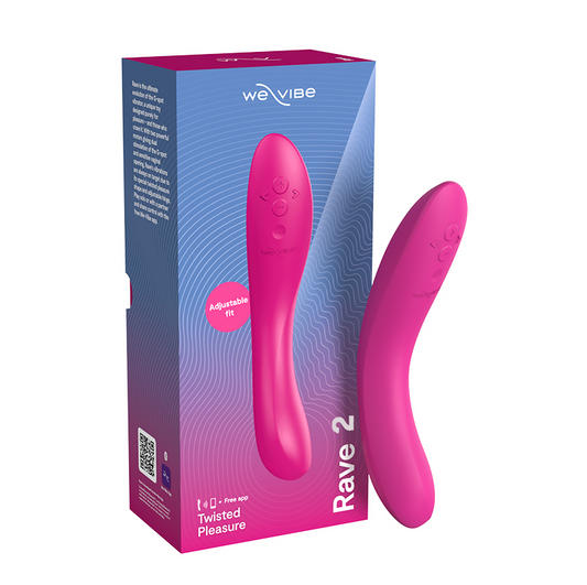 A pink We-Vibe Rave 2 vibrator beside its packaging box, which is also pink with abstract designs and branding information.