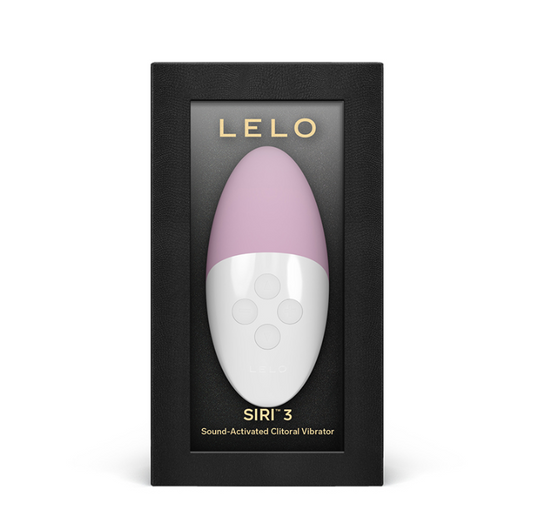 A pink and white vibrator named 'Lelo Siri 3' in its packaging, with a button-like control panel on the front. The packaging is black with the brand name 'LELO' prominently displayed.