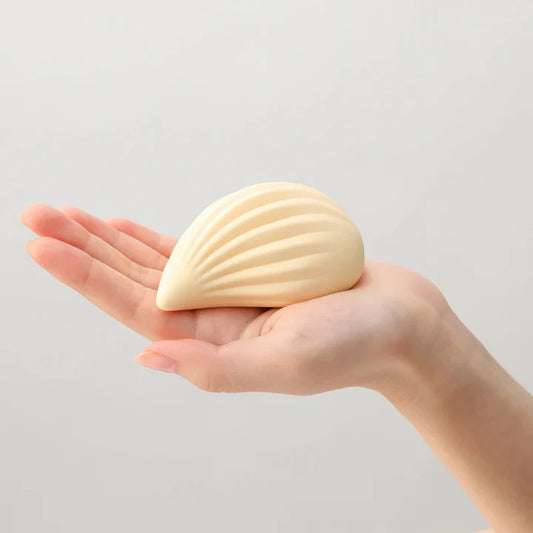 Tenga Iroha Kushi soft-touch ribbed vibrator – blush-colored, waterproof external massager with curved body and tapered tip.