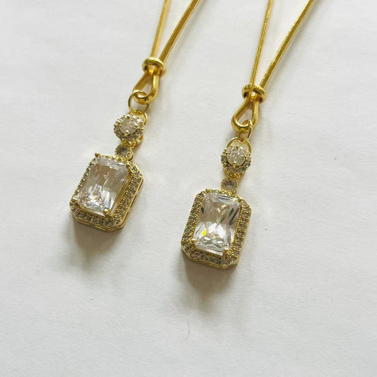 Gold nipple clamps with rectangular clear gem and crystal accent – PurpleNight.ca
