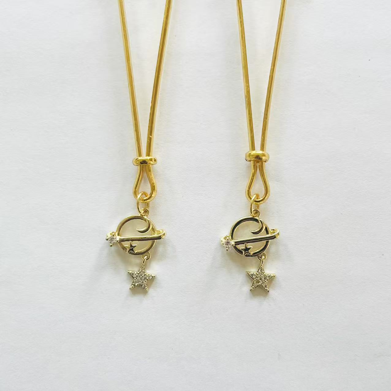 Gold nipple clamps with orbit planet and dangling star charm – PurpleNight.ca