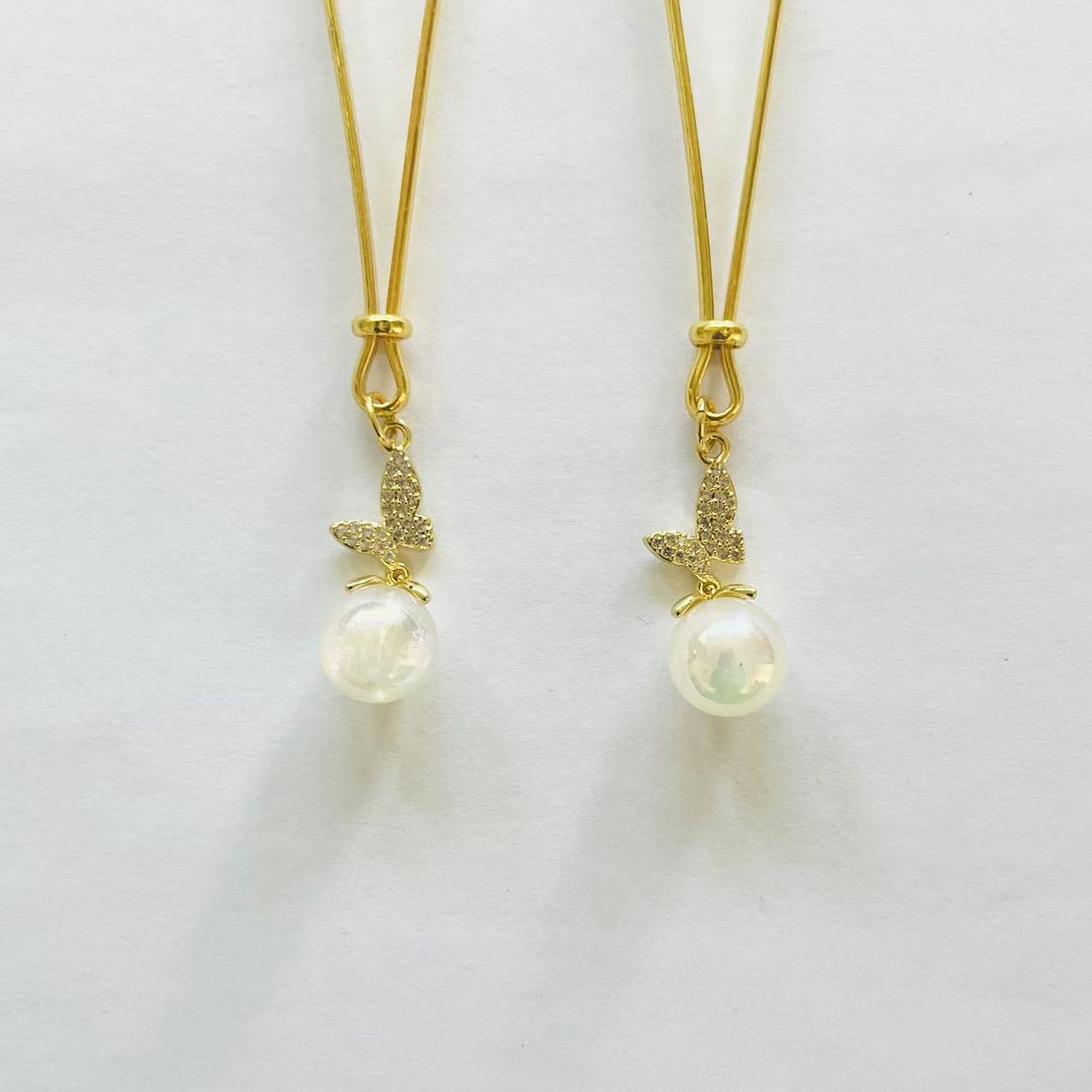 Gold nipple clamps with pearl drop and butterfly charm – PurpleNight.ca