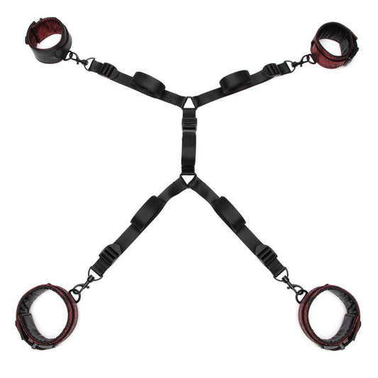 Black restraint set with red leather cuffs on a white background