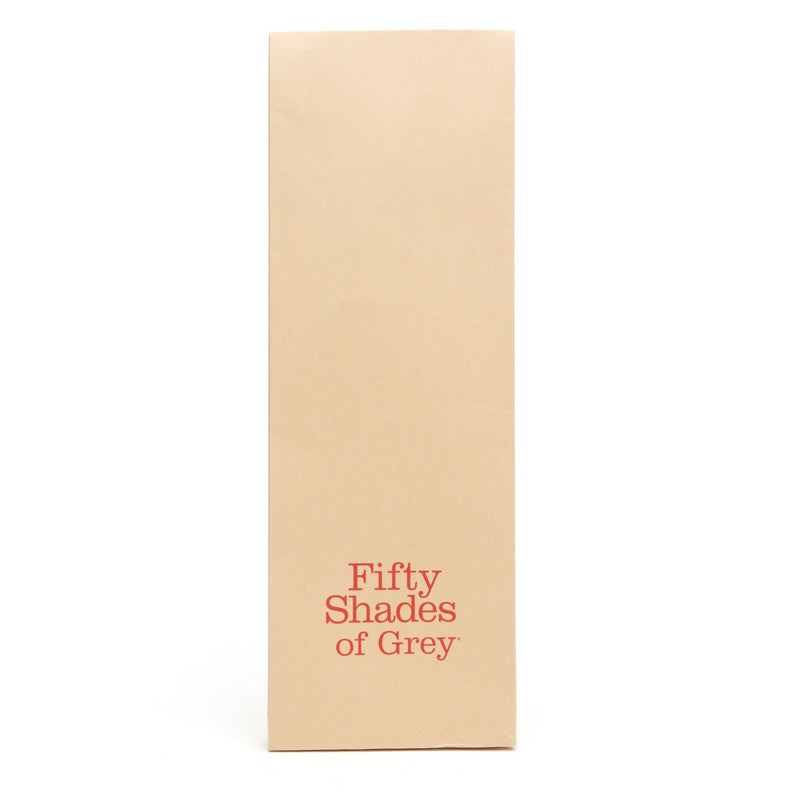 Beige book with 'Fifty Shades of Grey' in red text on a white background