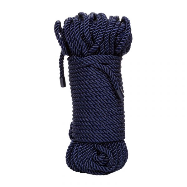 Coiled navy blue rope on a white background