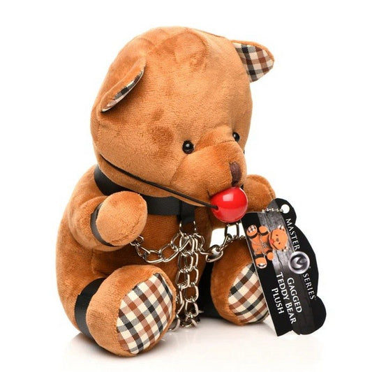 Plush toy bear with checkered details and a tag on a white background