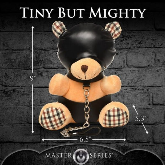 Teddy bear with plaid accents and measurements against a dark brick wall, featuring 'Master Series' branding.
