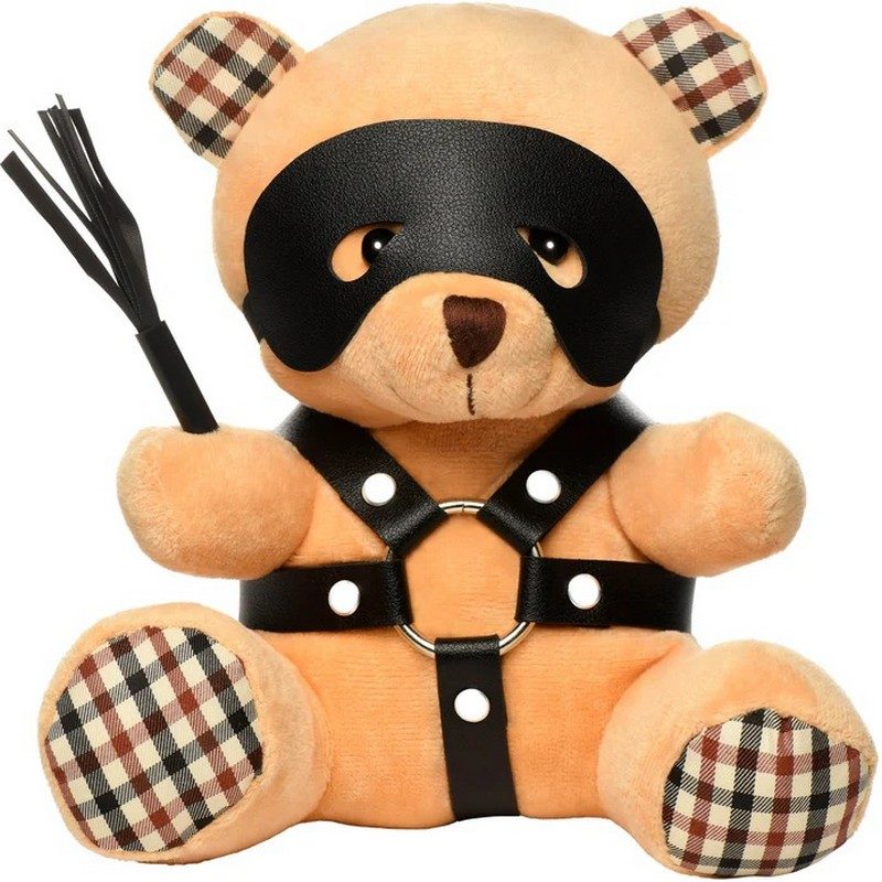 Teddy bear with a black mask, harness, and checkered details on a white background