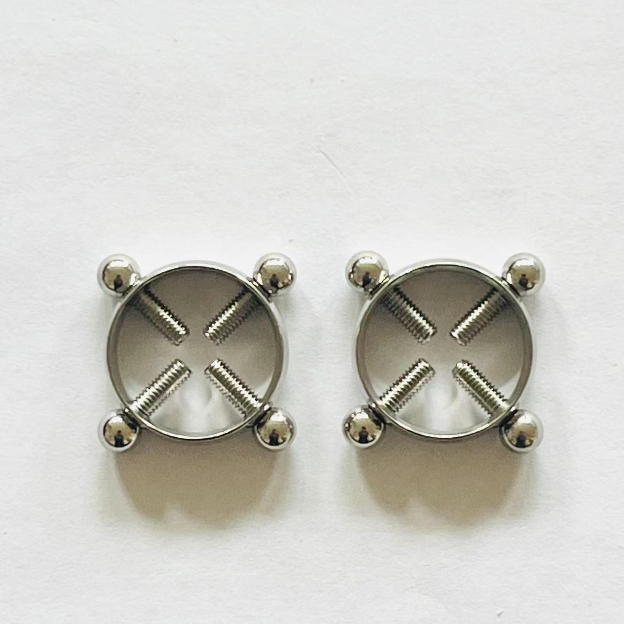 Pair of stainless steel 4-screw nipple press rings
