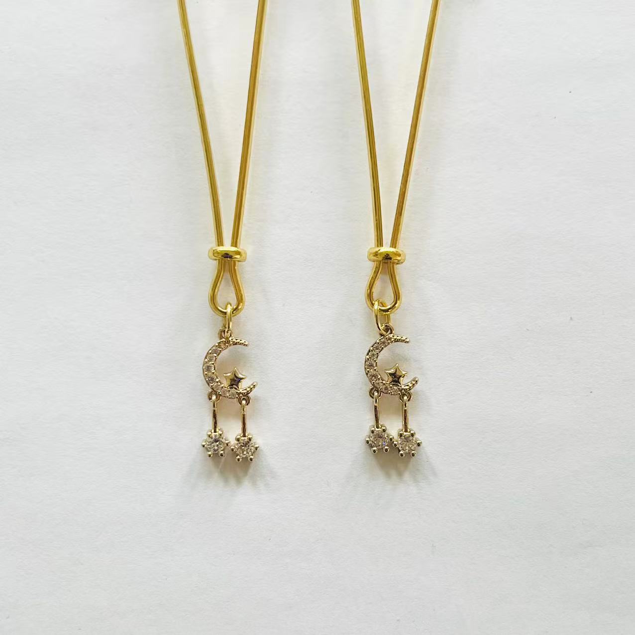 Gold nipple clamps with rhinestone crescent moon and double dangling star chains – PurpleNight.ca