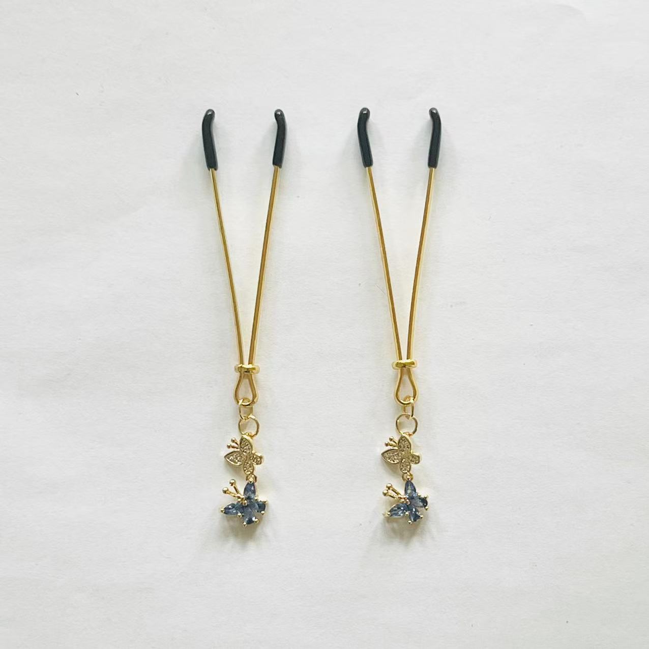 Elegant gold nipple clamps with blue crystal flower and butterfly charm – PurpleNight.ca