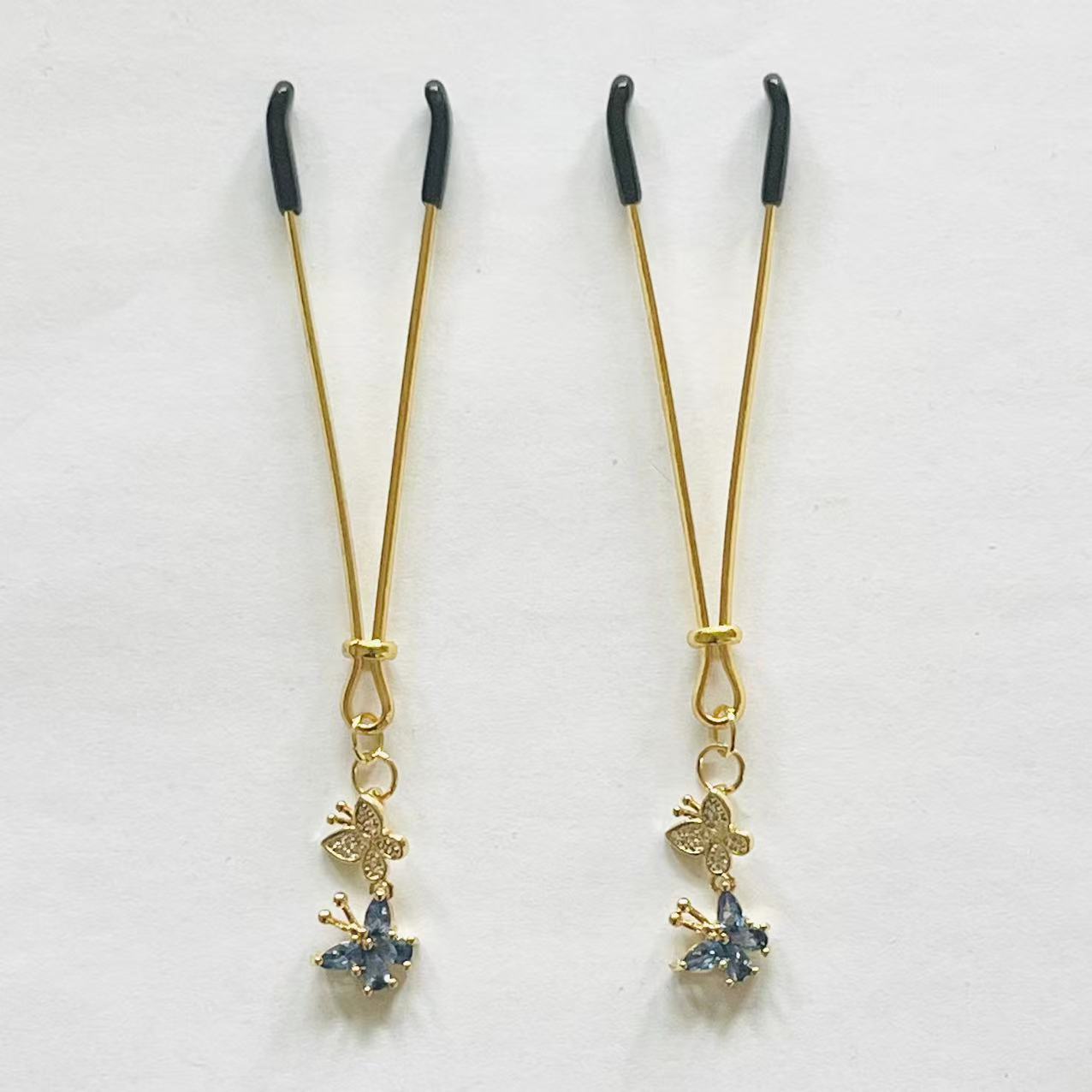 Elegant gold nipple clamps with blue crystal flower and butterfly charm – PurpleNight.ca