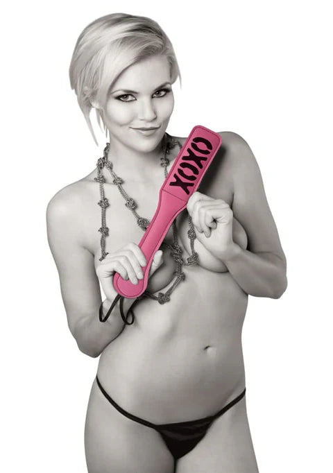 Sportsheets XOXO Paddle in pink vegan leather with cheeky imprint