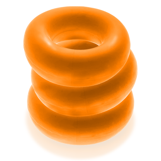 A stack of three orange Oxballs FAT WILLY jumbo cockrings.