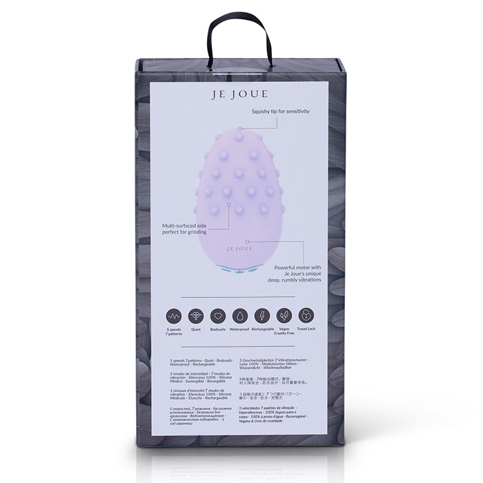 Je Joue Mimi Deux laying on soft fabric with USB charging cable