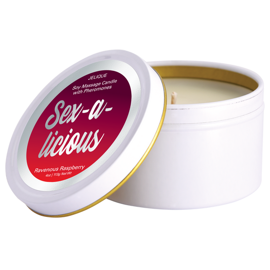 A white soy massage oil candle with a gold lid, labeled 'Sex-A-Licious Ravenous Raspberry' by Jelique.