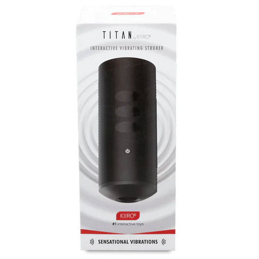 The image shows the Kiiroo Titan Interactive Vibrating Stroker in its packaging. The product is black with a glossy finish and features multiple touch-sensitive vibration controls on its surface.