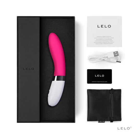 Pink and white Lelo product with packaging, cable, and care card on a white background