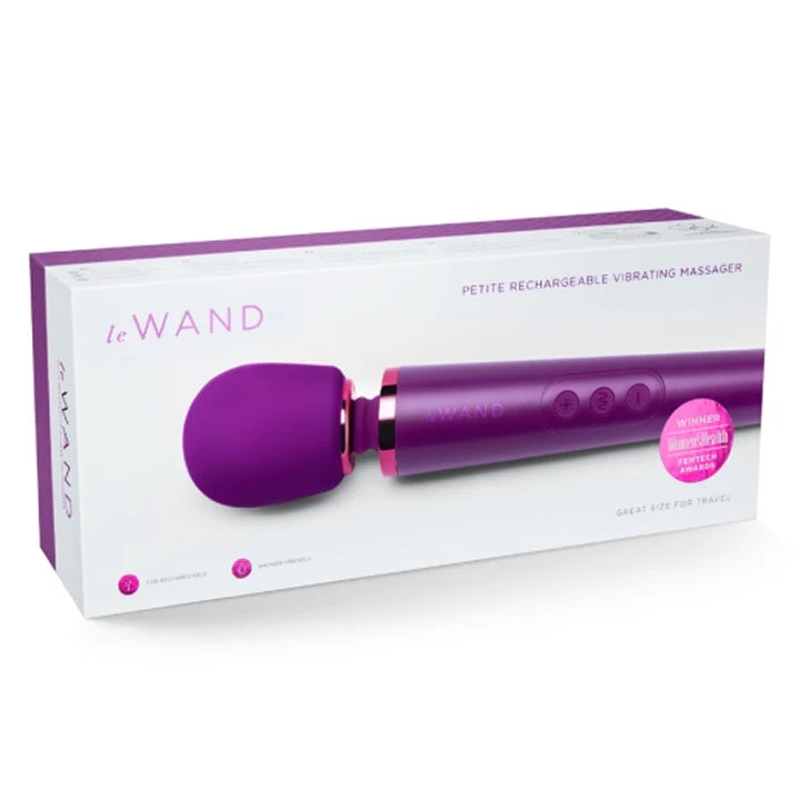 Purple and pink 'Le Wand' petite rechargeable vibrating massager on a white box