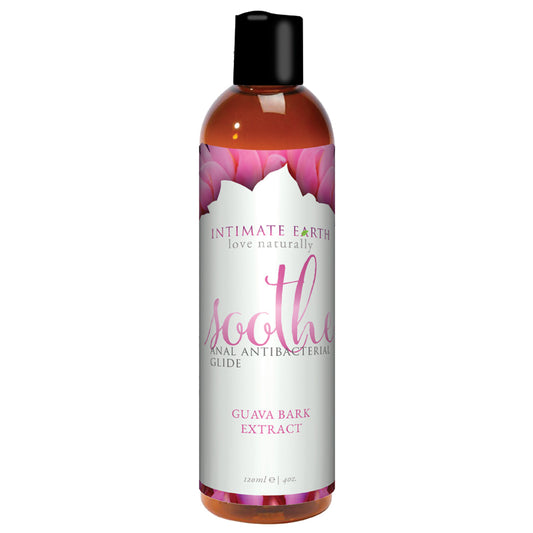 A bottle of Intimate Earth Soothe Anal Lube with Guava Bark Extract. The packaging is predominantly white and purple with a clear label and a black cap.