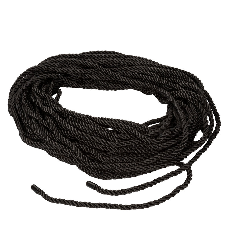Coiled black rope on a white background