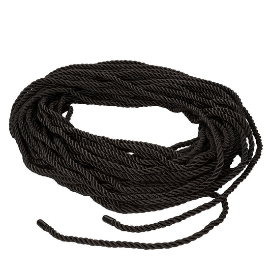 Coiled black rope on a white background