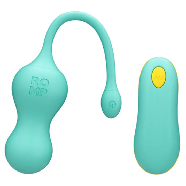 ROMP Cello vibrator next to USB cable and remote