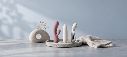 Different vibrator materials displayed in a clean product photography setting