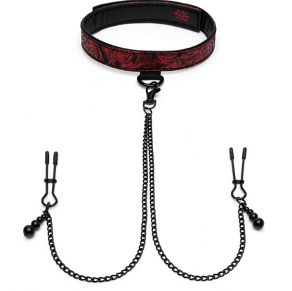 The image shows a black and red padded collar connected to adjustable nipple clamps by a chain. The collar has a satin-like texture on one side and a faux leather finish on the other, with a padded rose-print design.