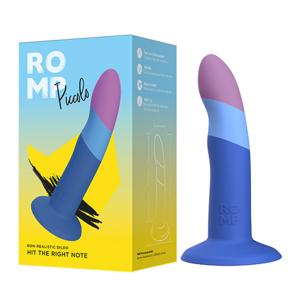 A purple silicone dildo with a curved shaft and flared base, shown next to its colorful packaging that highlights the product's features.
