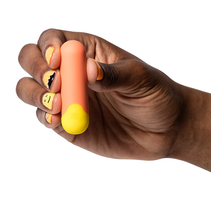 ROMP Riot vibrator with USB charging cable and instruction booklet