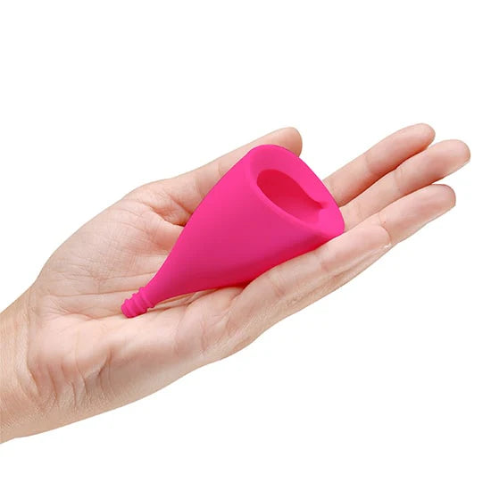 INTIMINA Lily Cup menstrual cup in pink with angled shape and smooth design