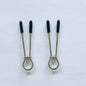 Minimalist stainless steel loop nipple clamps with black rubber tips on white background.