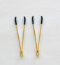 Gold adjustable wire-style nipple clamps with black rubber tips, minimalist BDSM design