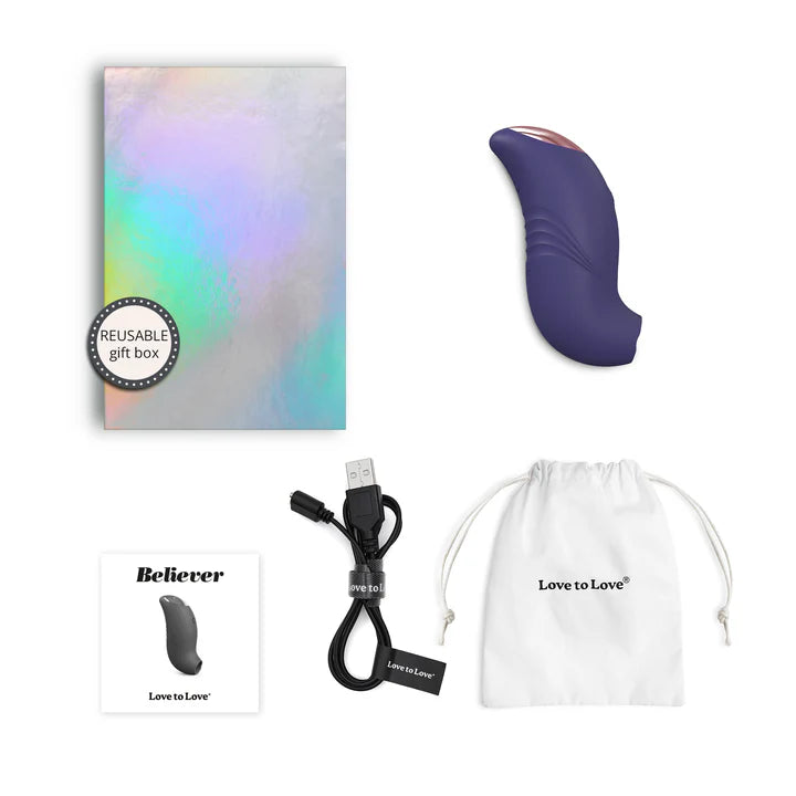 A small, ergonomically designed clitoral stimulator in blush pink, featuring a flapping silicone membrane and LED-lit button.