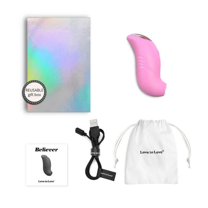 A small, ergonomically designed clitoral stimulator in blush pink, featuring a flapping silicone membrane and LED-lit button.