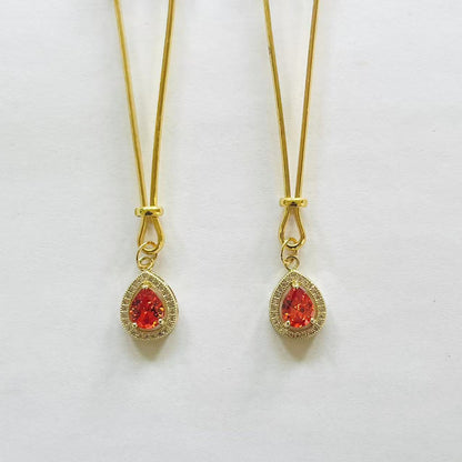 Gold nipple clamps with red-orange teardrop gem and crystal halo – PurpleNight.ca
