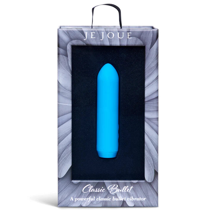 Vibrator with USB charger and sleeve laid on soft fabric