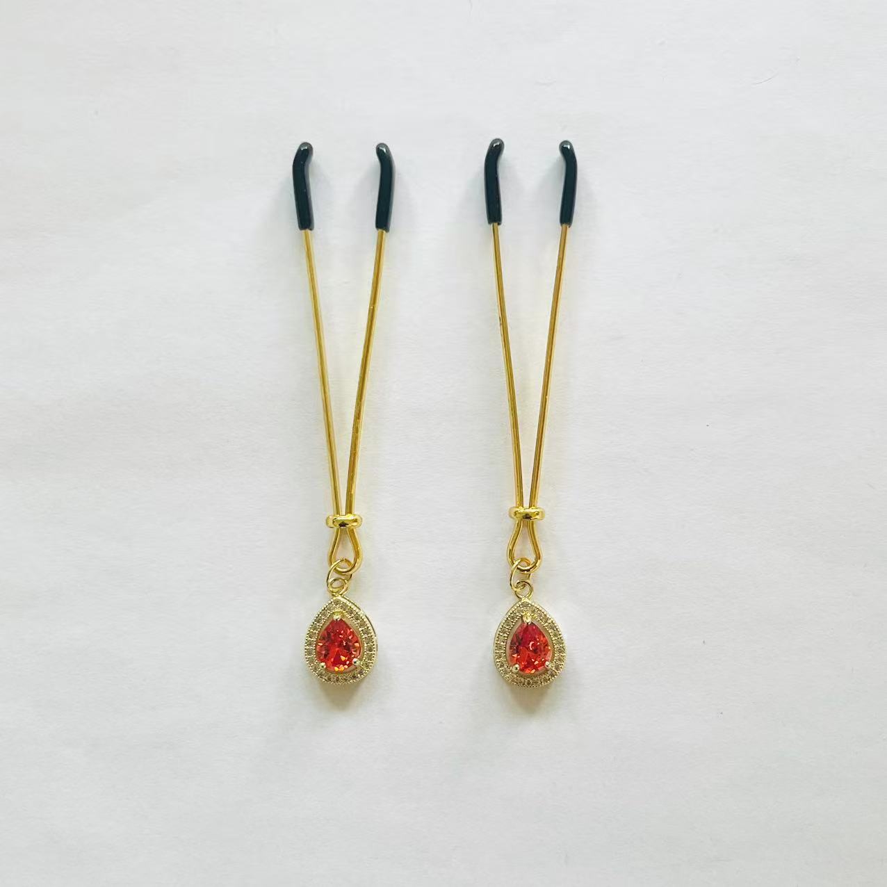 Gold nipple clamps with red-orange teardrop gem and crystal halo – PurpleNight.ca
