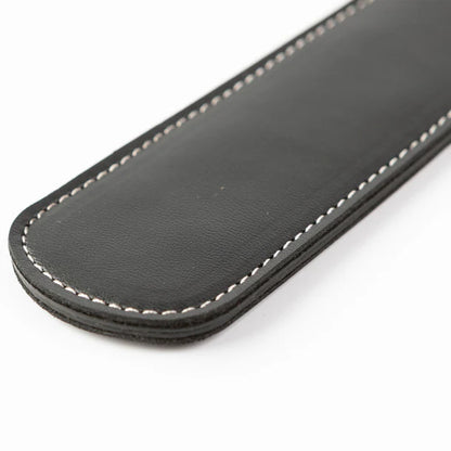 SEI MIO Rule My World Flexible Impact Paddle – black faux leather spanking paddle with wrist loop for BDSM and dominance play.