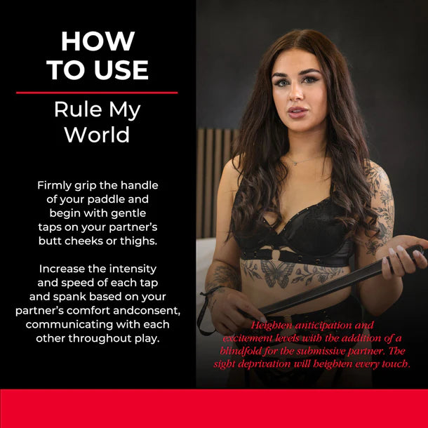 SEI MIO Rule My World Flexible Impact Paddle – black faux leather spanking paddle with wrist loop for BDSM and dominance play.