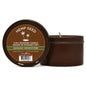 A round tin massage candle with a brown label that reads 'Hemp Seed' and 'ZIN-I MASSAGE CANDLE BOUGE DE MASSAGE 3 GUAVALA' indicating a hemp seed-based candle with a massage oil function. The candle is visible in the background, and the label includes product information and a barcode.
