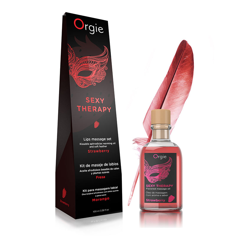 Orgie Sexy Therapy lip massage set with packaging and feather on a white background