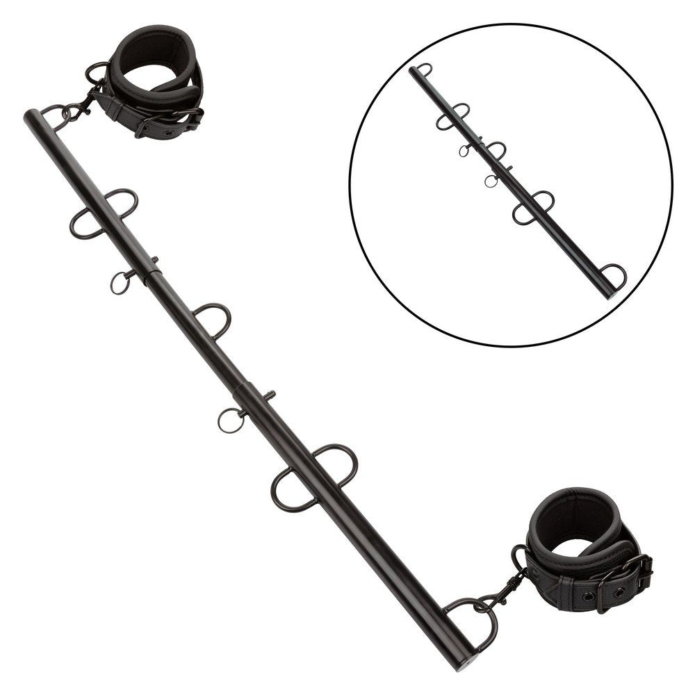 CalExotics Nocturnal Collection Spreader Bar with adjustable length, detachable ankle cuffs, and swivel D-rings for stylish BDSM restraint play