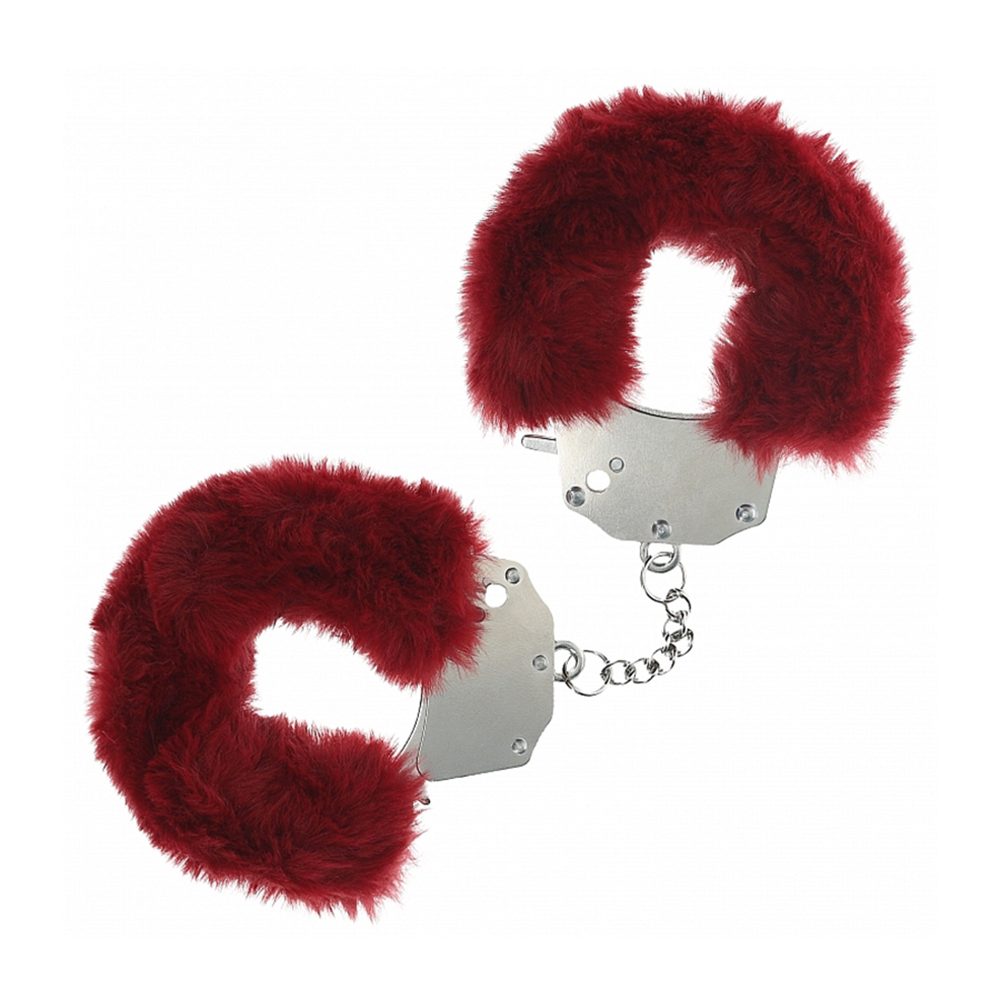 Red furry handcuffs on a white background