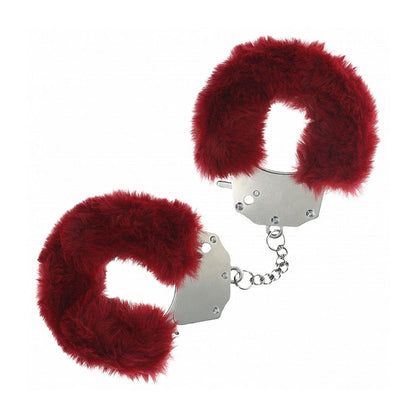 Red furry handcuffs on a white background