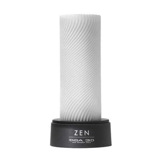 The image shows a white male masturbator with a textured surface, labeled 'Tenga 3D' and 'Zen'. It is mounted on a black stand with the brand name visible.