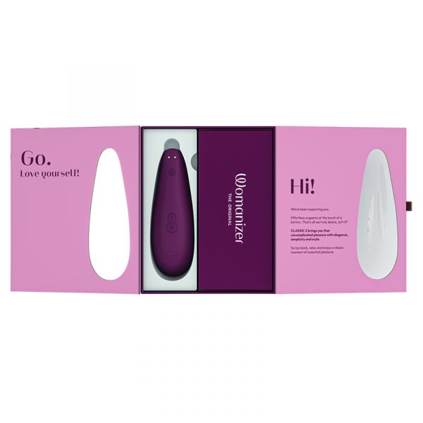 Purple device in a pink packaging box with 'Womanizer' branding.