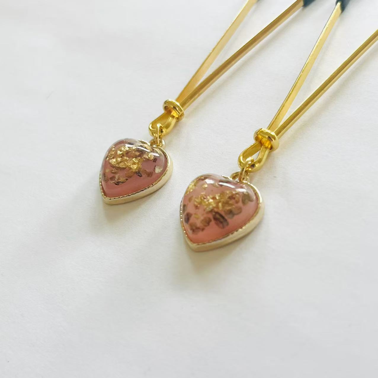 Gold nipple clamps with pink heart charm and embedded gold foil – PurpleNight.ca