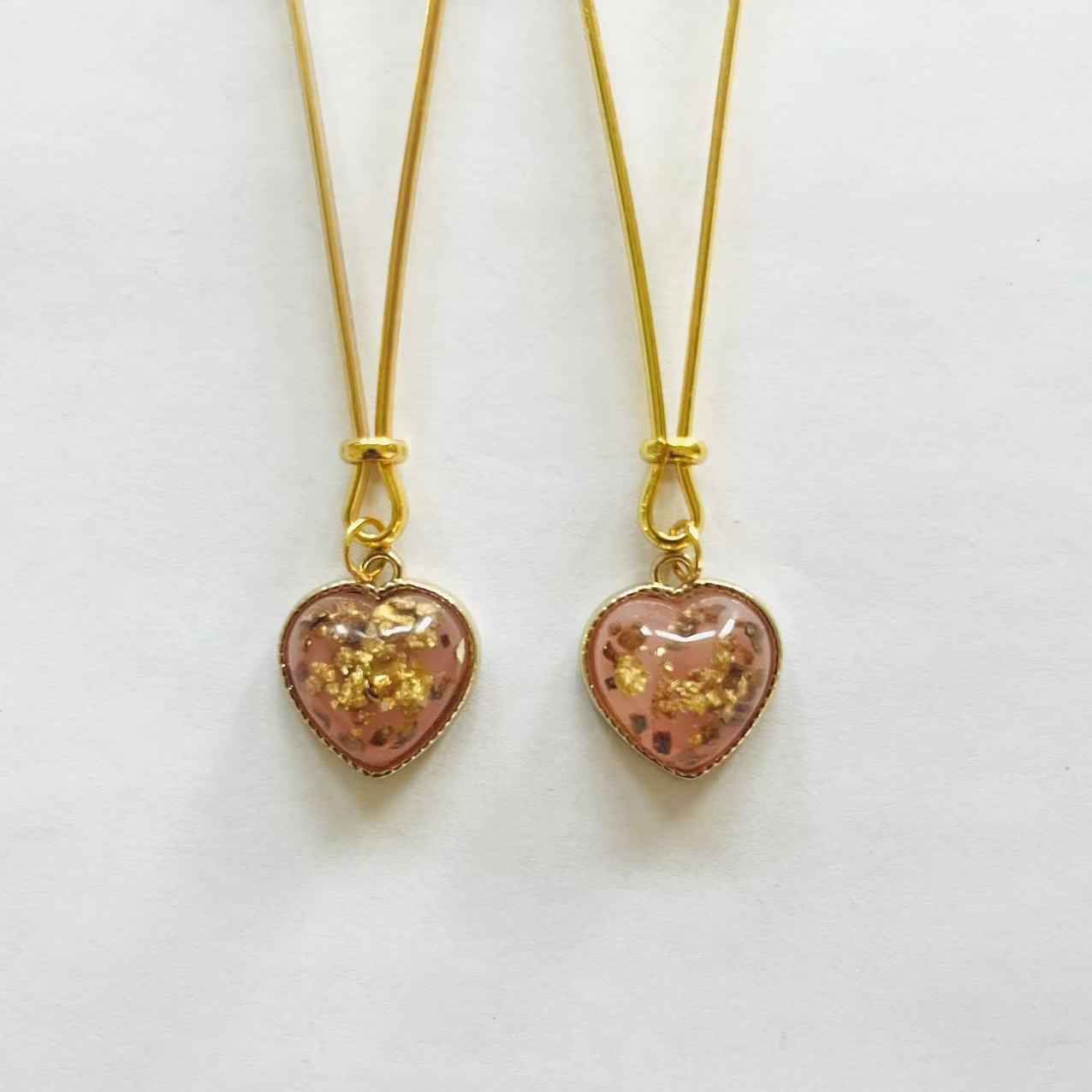 Gold nipple clamps with pink heart charm and embedded gold foil – PurpleNight.ca